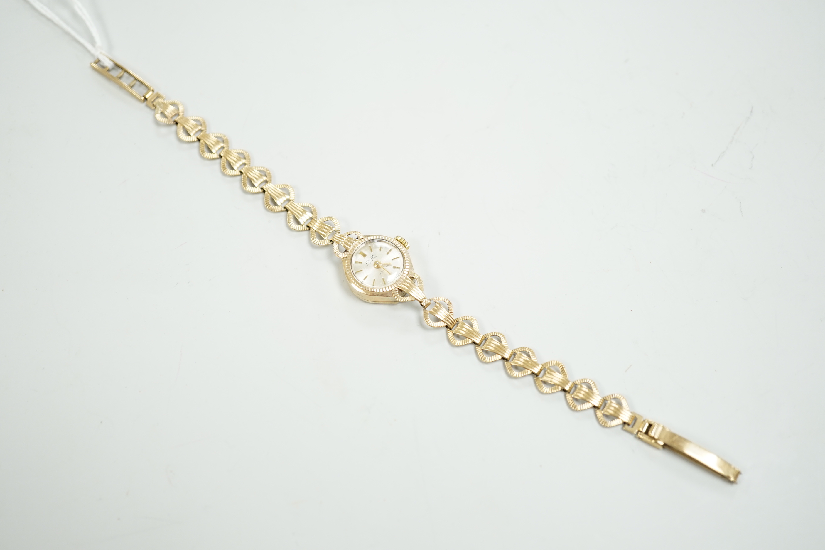 A lady's 9ct gold Avia manual wind wrist watch, on a 9ct gold bracelet, overall length 18cm, gross weight 9.3 grams.